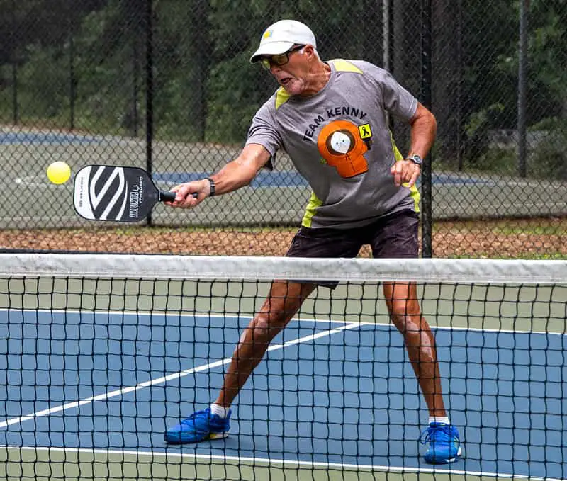 a player hitting pickleball