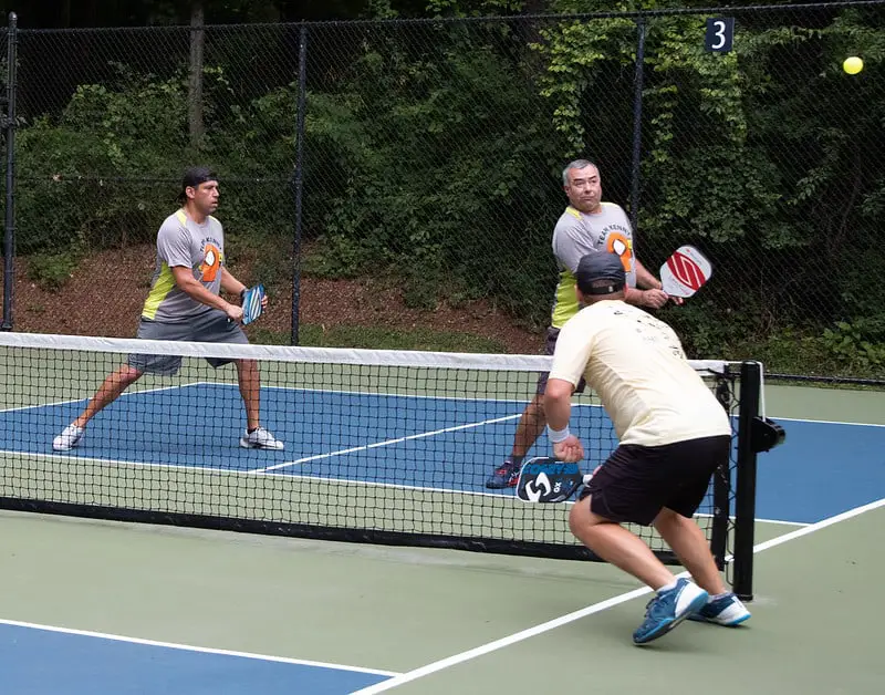 players playing pickleball with paddle